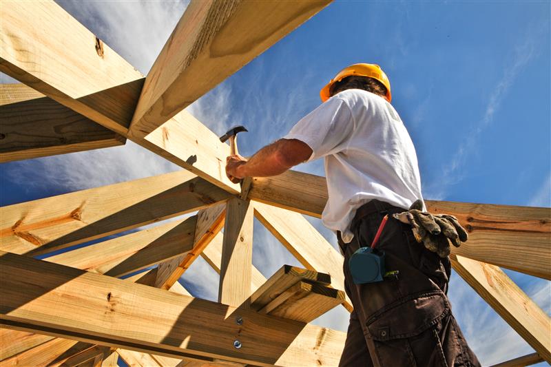 Construction worker building a wood foundation